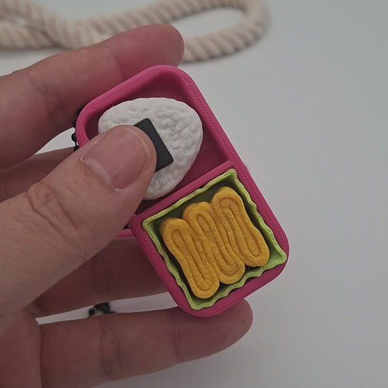 3D-gedruckter Mini-Lunchbox Fidget Klicker mit liebevollem Design.