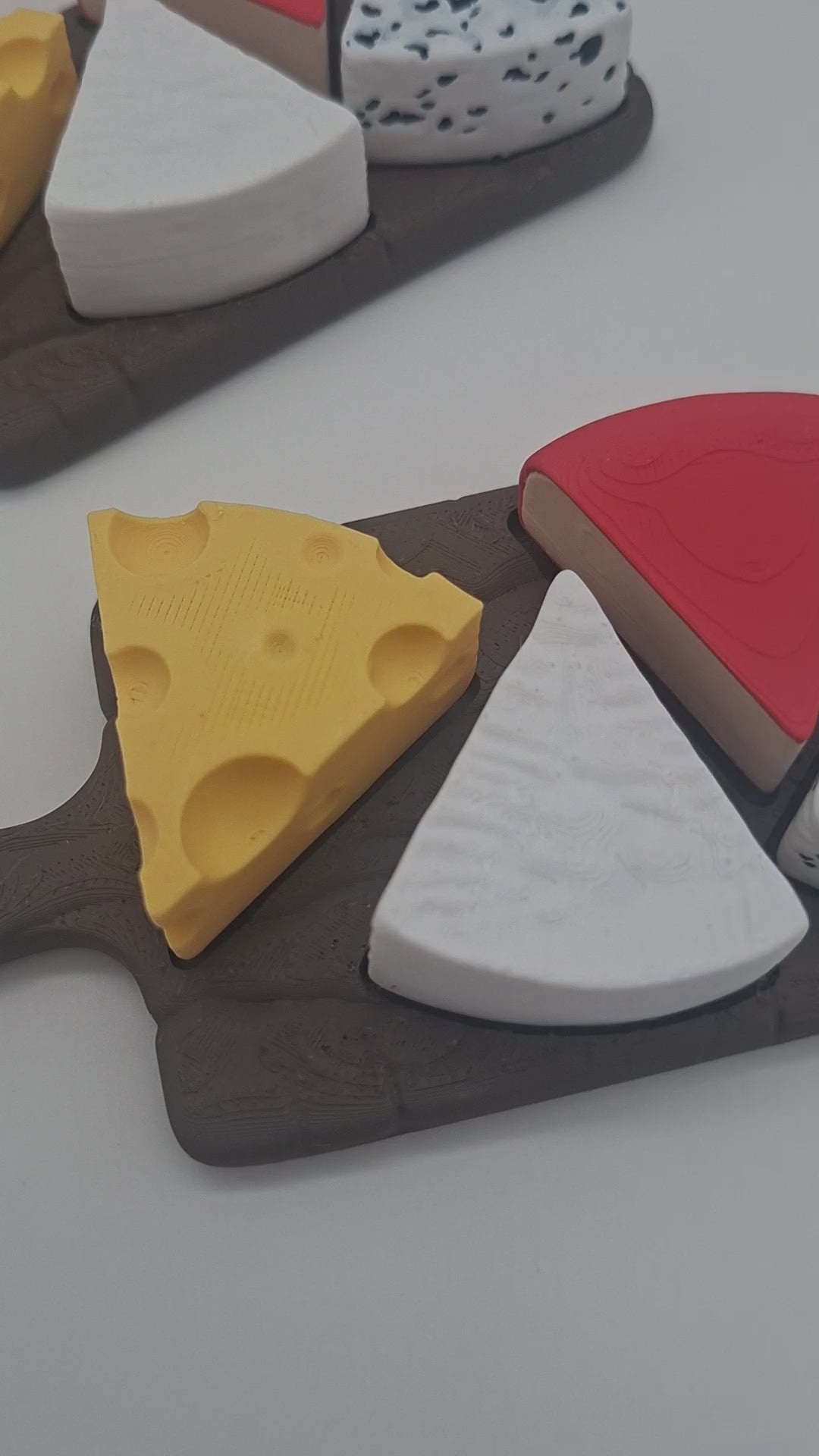 3D-gedruckter Käseplatten Fidget Klicker mit liebevollem Design.